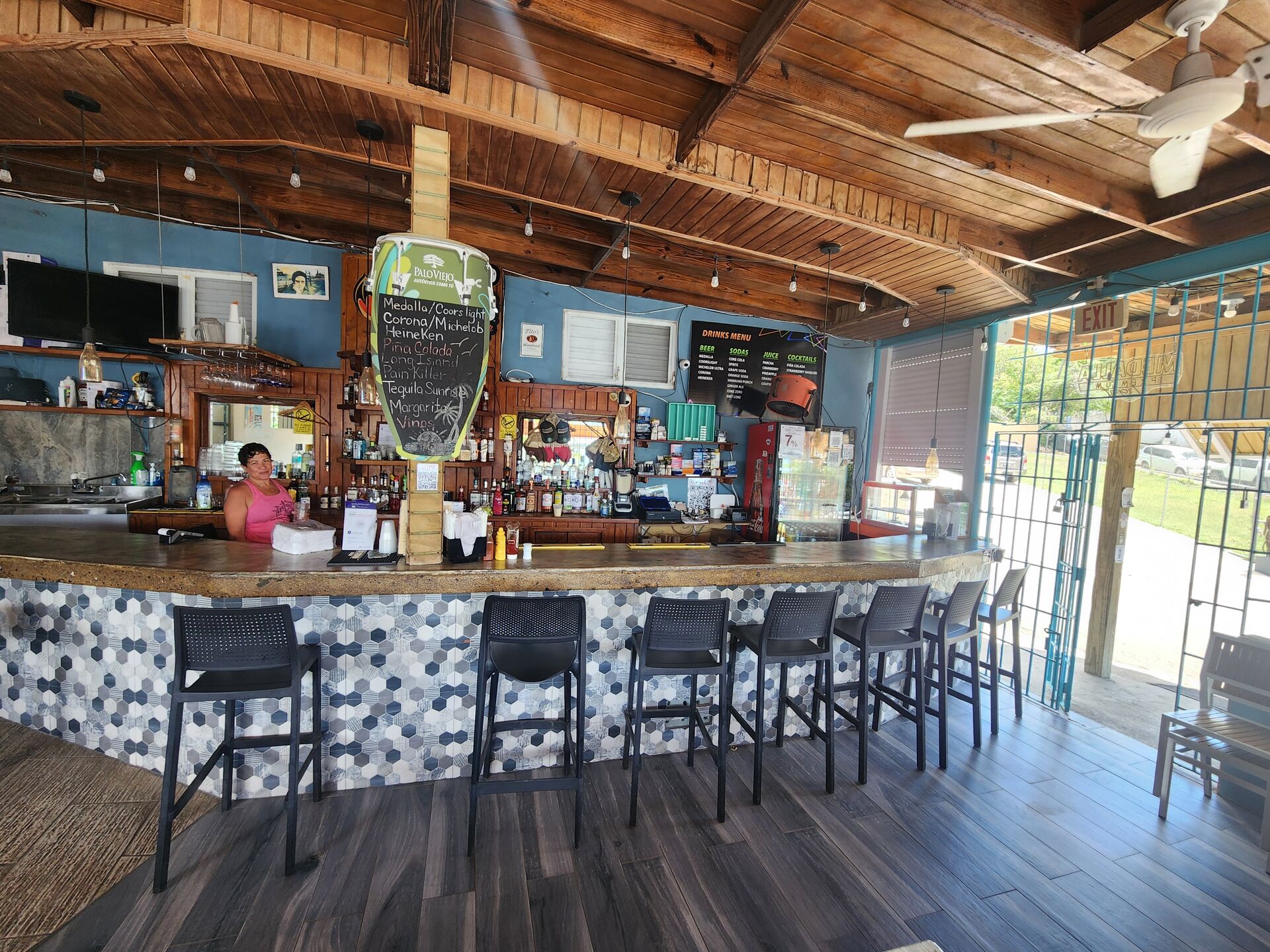 El Yate bar interior — bartender at the mosaic tile bar in Isabel Segunda, Vieques